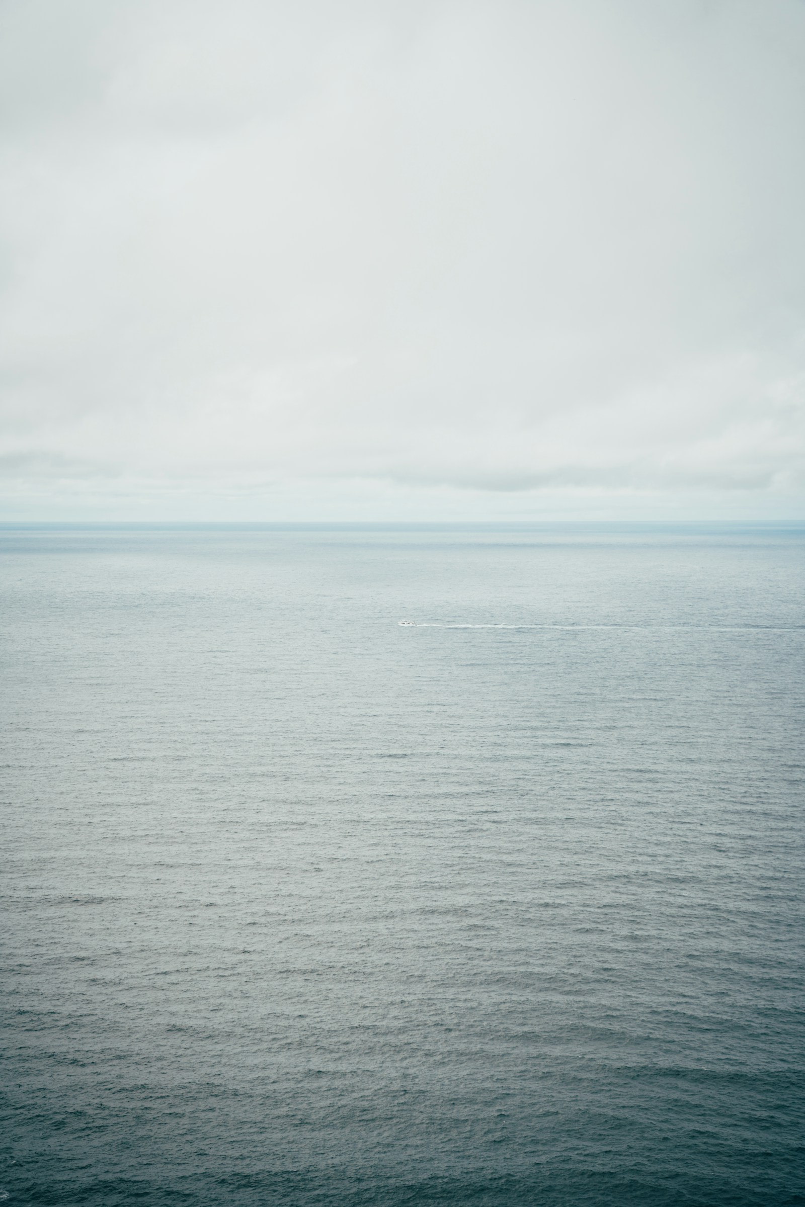 Calm sea under a cloudy sky when planning around weather