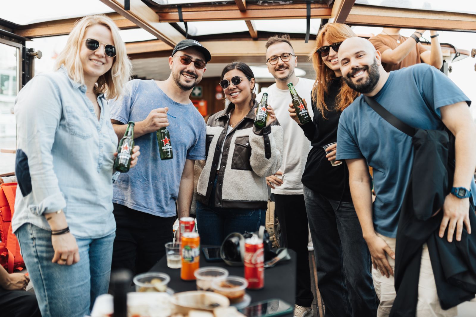 Group of friends with drinks on a private boat day