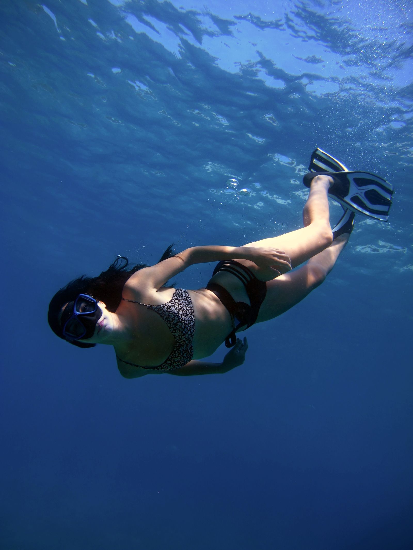 Snorkeller underwater in clear blue sea