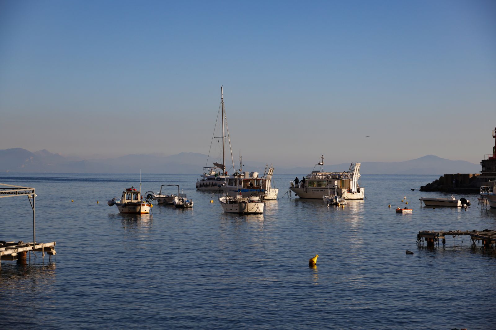 Boats on calm water at sunrise — choosing a morning slot