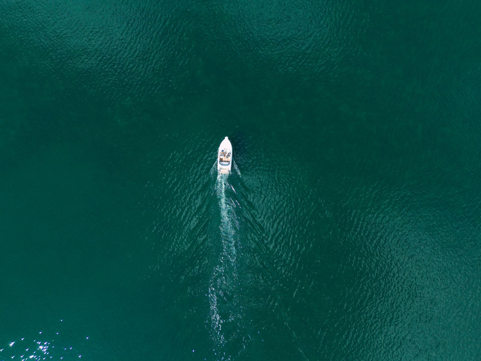 Aerial view of a rental boat on clear Zakynthos water